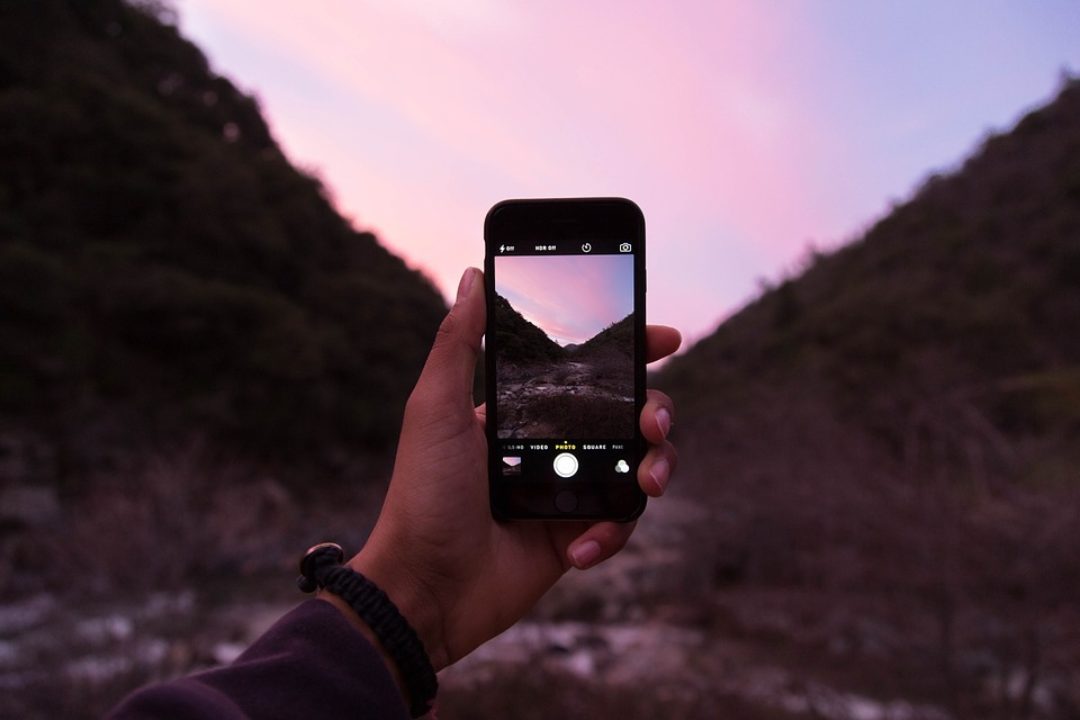 Screen view of phone camera capturing desert scenery