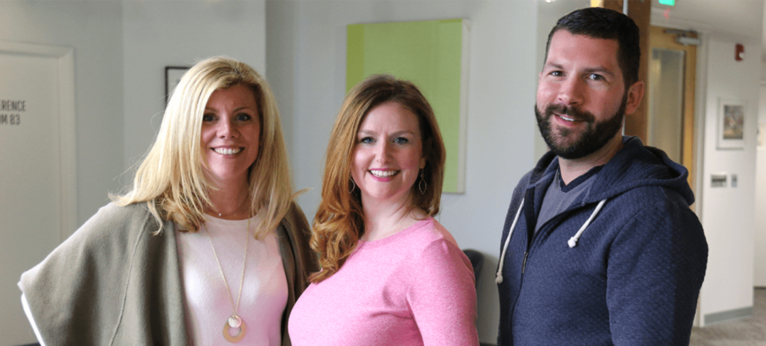 Tara Johnson, Caitlin Currey, and Jake Tarbert stand in the idfive office