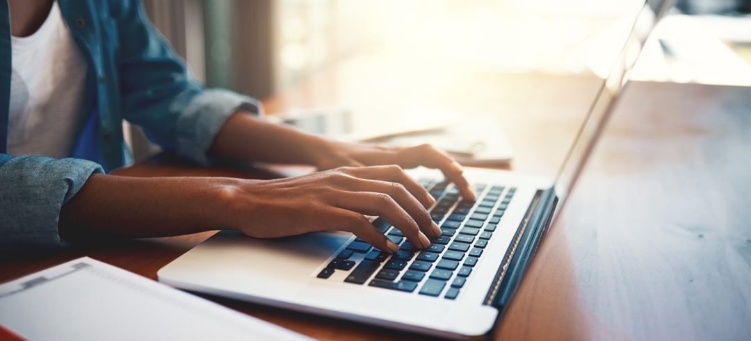 Woman typing on laptop