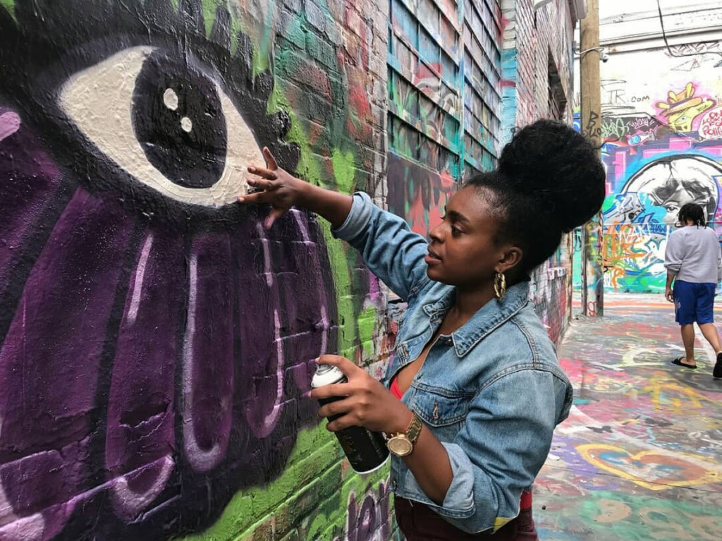 Woman doing graffiti art