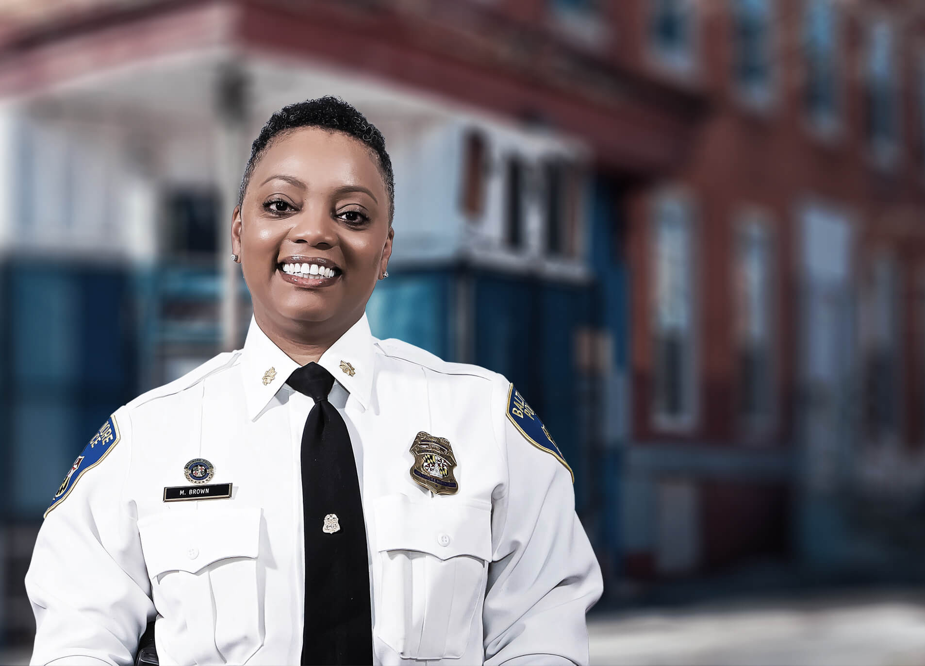 Female baltimore police officer in white uniform