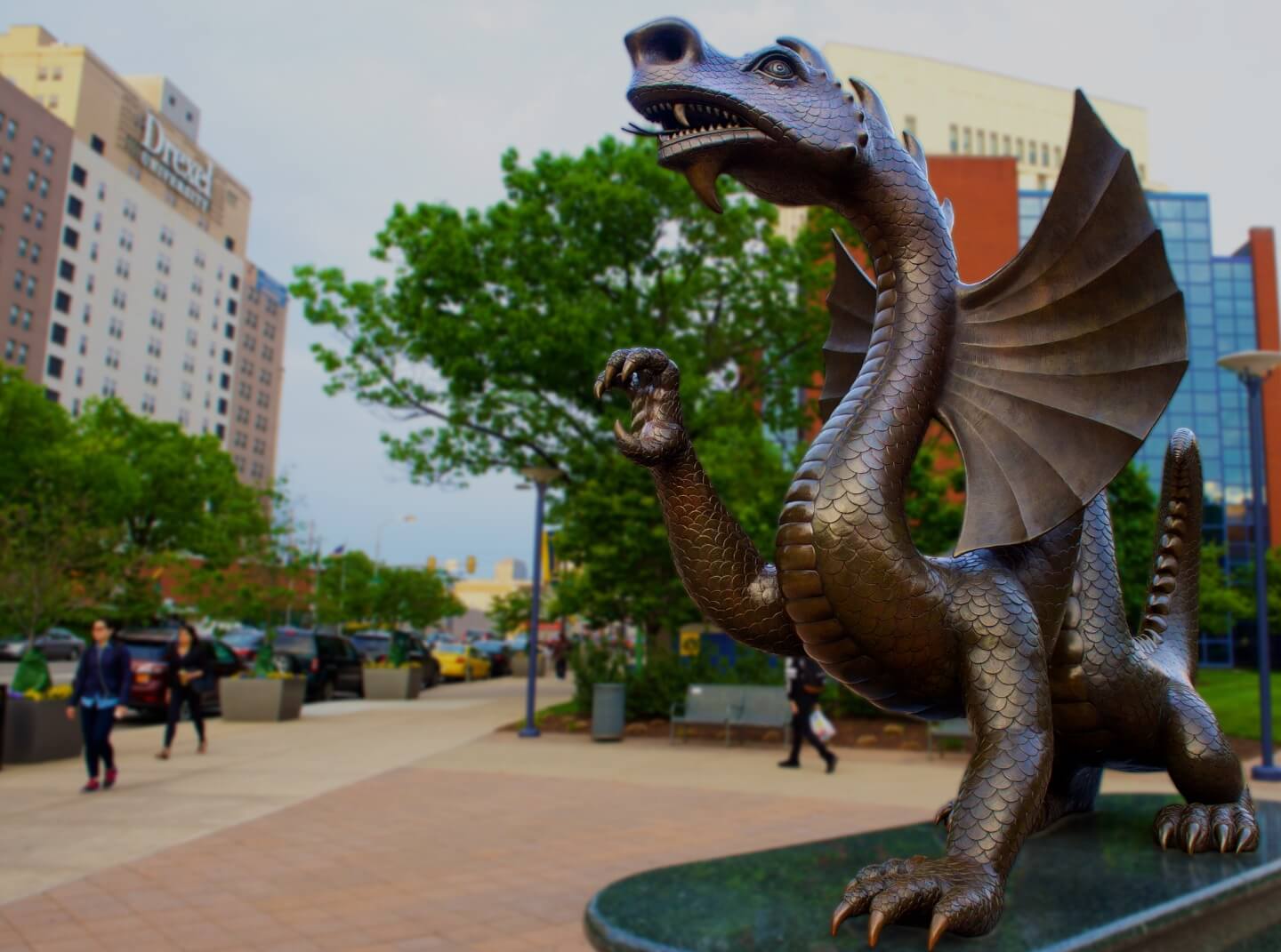 The dragon statue bares its claws at dusk on the Drexel LeBow College of Business campus.