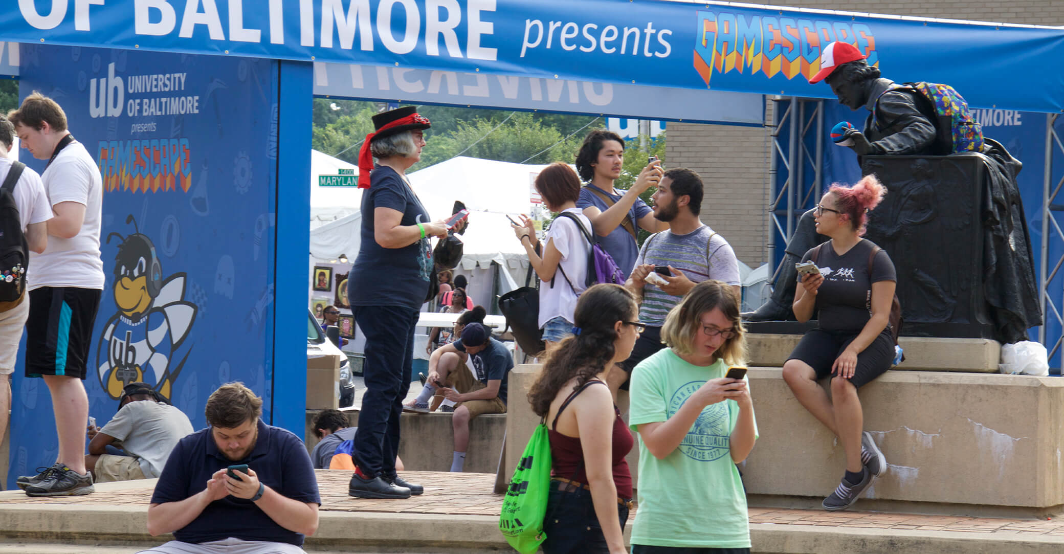 People playing pokemon go at event