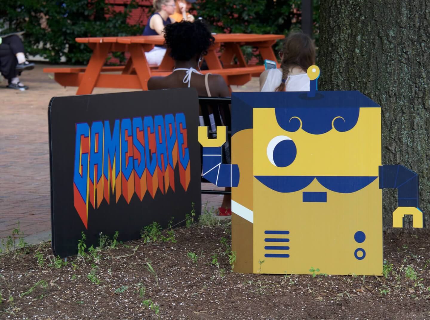 idfive designed cutouts of a robot and logo for the University of Baltimore's Gamescape interactive experience at Baltimore's Artscape