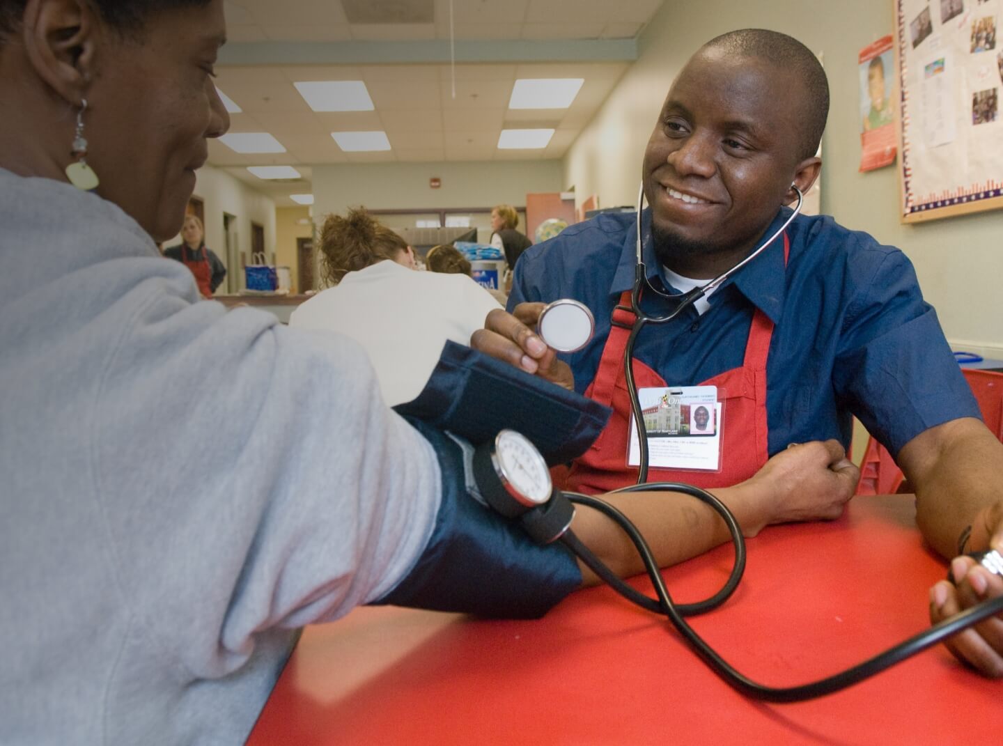 A University of Maryland School of Nursing student performs a blood pressure test at a community clinic