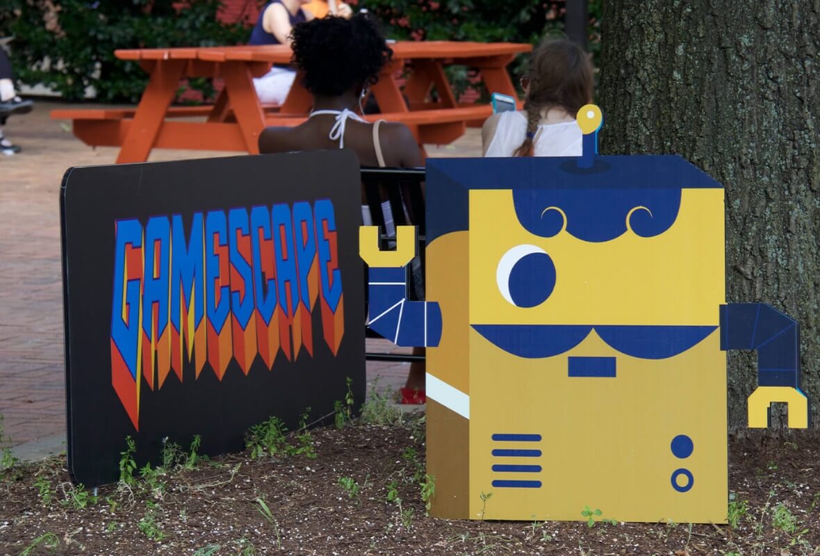 idfive designed cutouts of a robot and logo for the University of Baltimore's Gamescape interactive experience at Baltimore's Artscape
