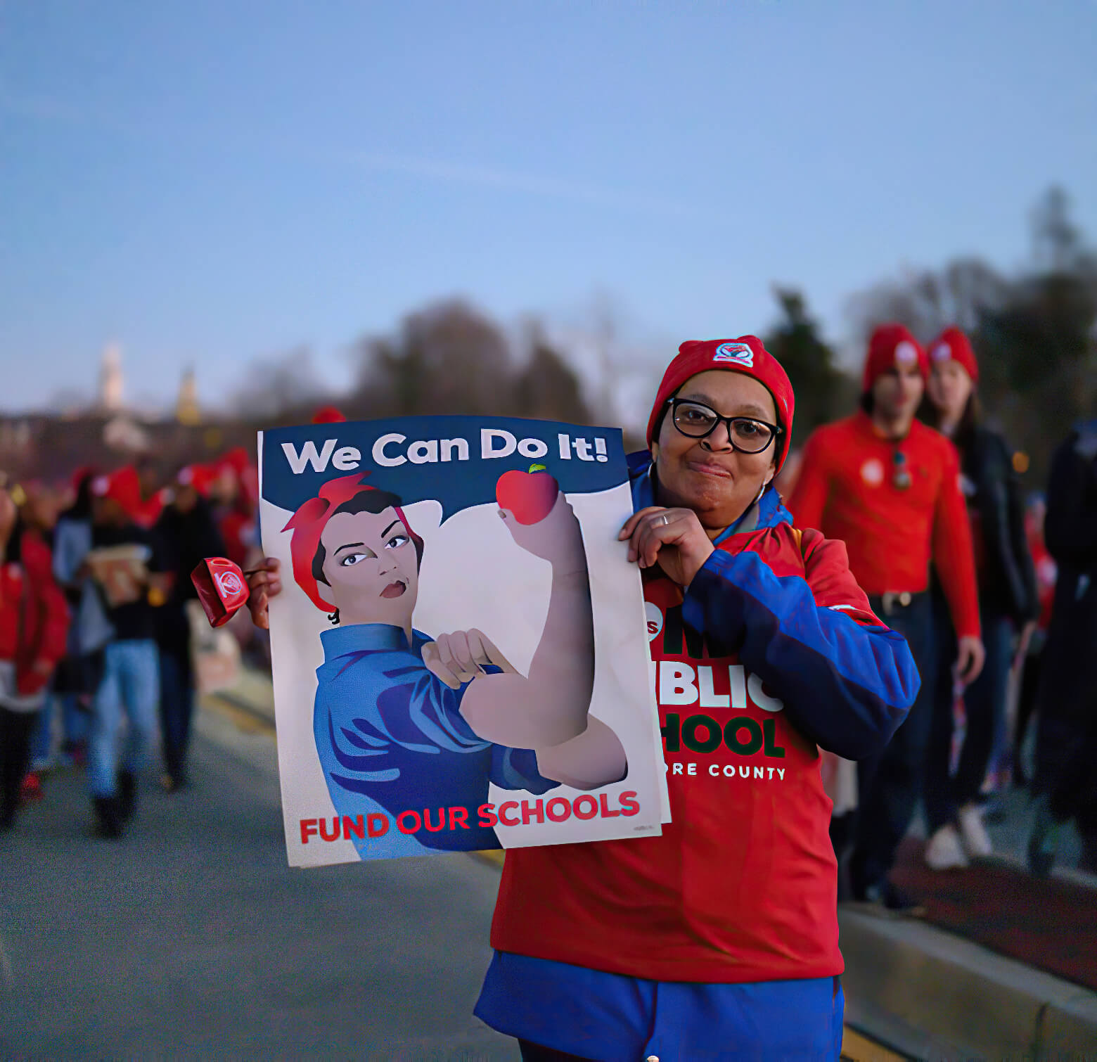 An education professional at a rally